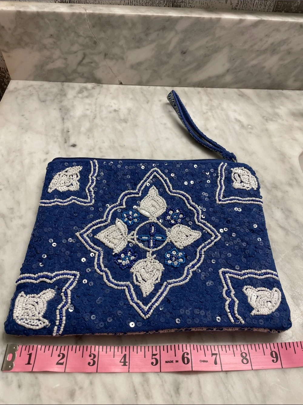 America & Beyond navy wristlet